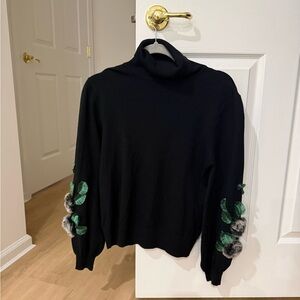 Sioni Black Turtleneck Sweater with Green Leaf Details
